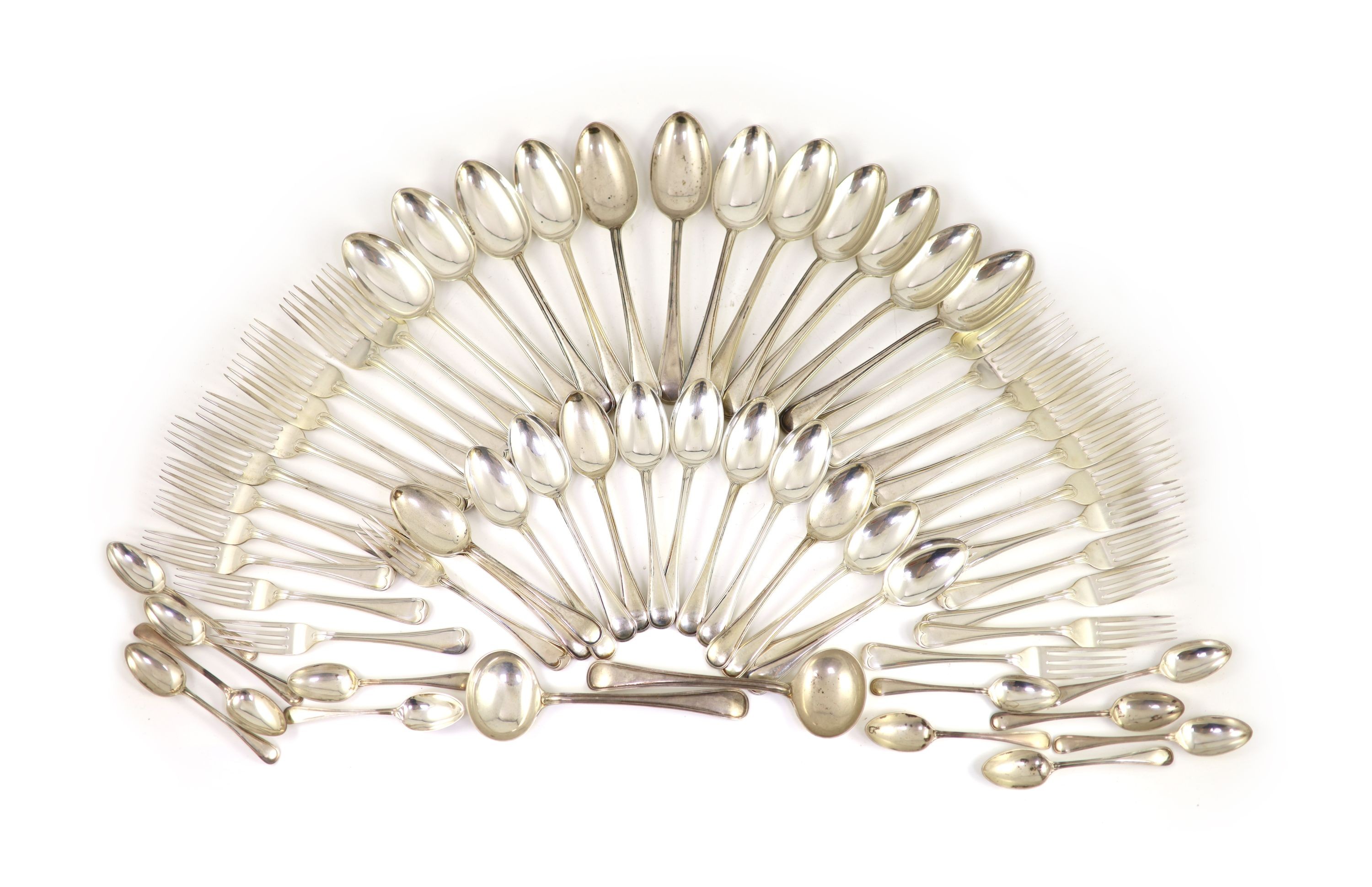 A part canteen of Edwardian silver Old English double struck thread pattern flatware for twelve by John Round & Son Ltd